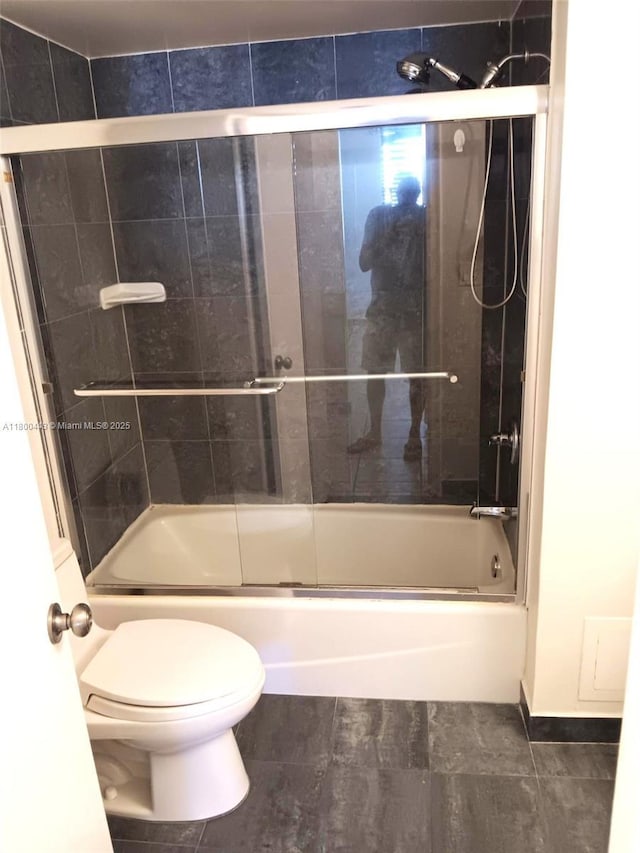 3703 NE 166th St Unit 704, North Miami Beach, FL 33160 - bathroom featuring enclosed tub / shower combo and toilet