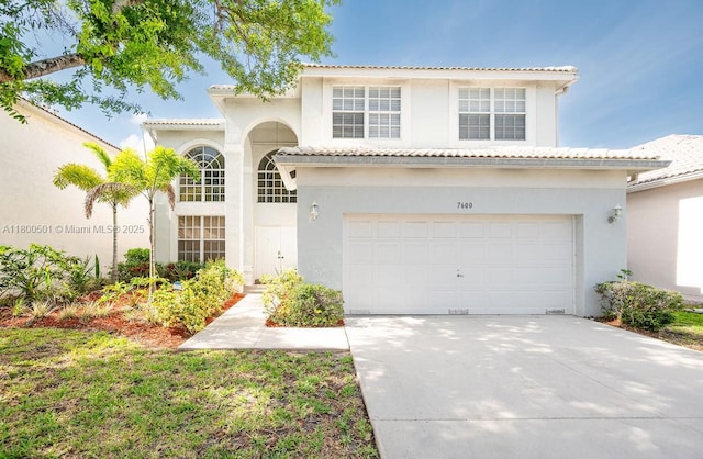 7600 Belmonte Blvd, Margate, FL 33063 - mediterranean / spanish home featuring stucco siding, driveway, a tile roof, and a garage