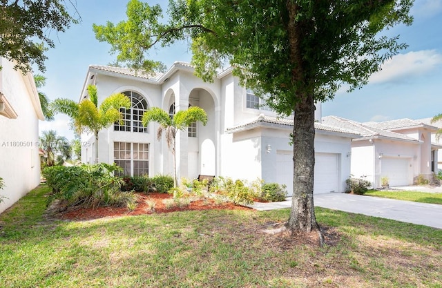 7600 Belmonte Blvd, Margate, FL 33063 - mediterranean / spanish-style home featuring a tiled roof, stucco siding, driveway, and an attached garage