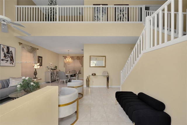 7600 Belmonte Blvd, Margate, FL 33063 - living area featuring a ceiling fan, a chandelier, light tile patterned floors, stairway, and a high ceiling