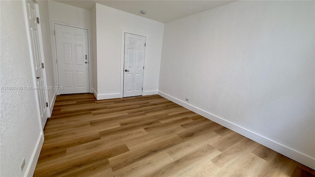 7334 Harding Ave Unit 3, Miami Beach, FL 33141 - empty room featuring light wood-style flooring and baseboards