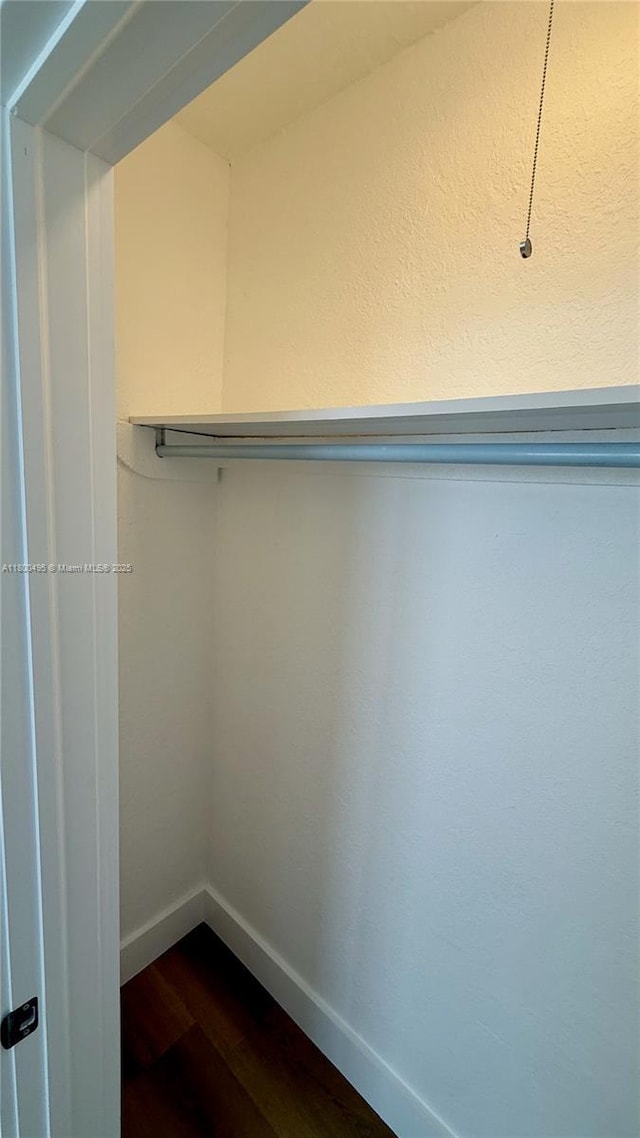 7334 Harding Ave Unit 3, Miami Beach, FL 33141 - spacious closet featuring dark wood-type flooring