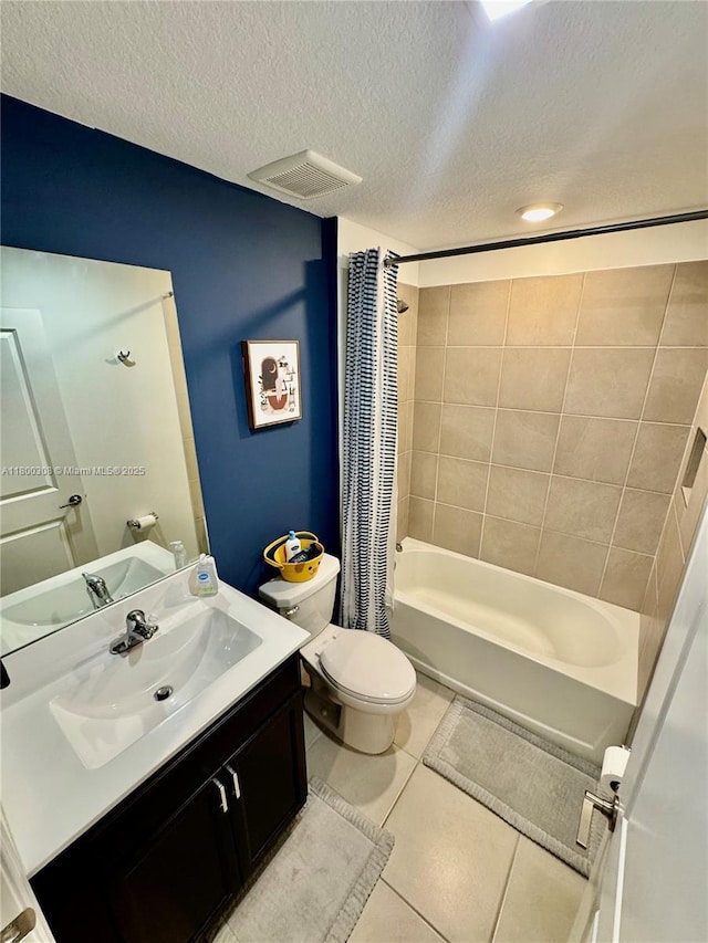 bathroom with shower / bathtub combination with curtain, tile patterned floors, vanity, a textured ceiling, and toilet