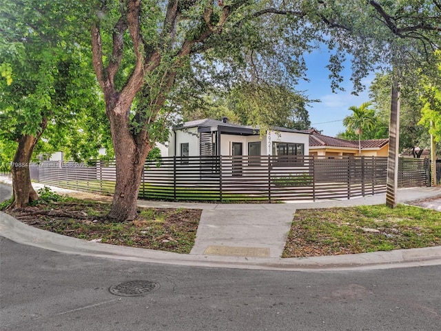 4921 NW 6th Ave, Miami, FL 33127 - view of front of house with stucco siding and a fenced front yard