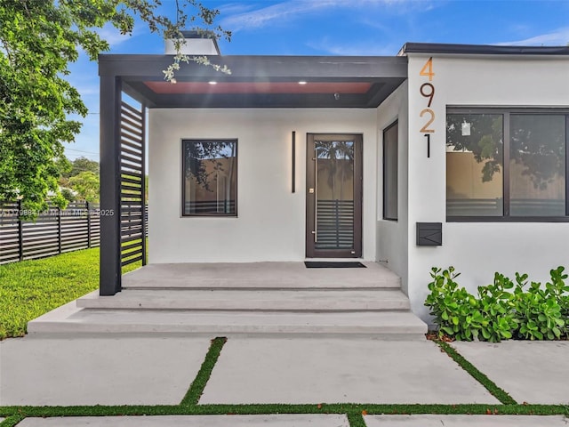 4921 NW 6th Ave, Miami, FL 33127 - view of exterior entry featuring stucco siding and fence