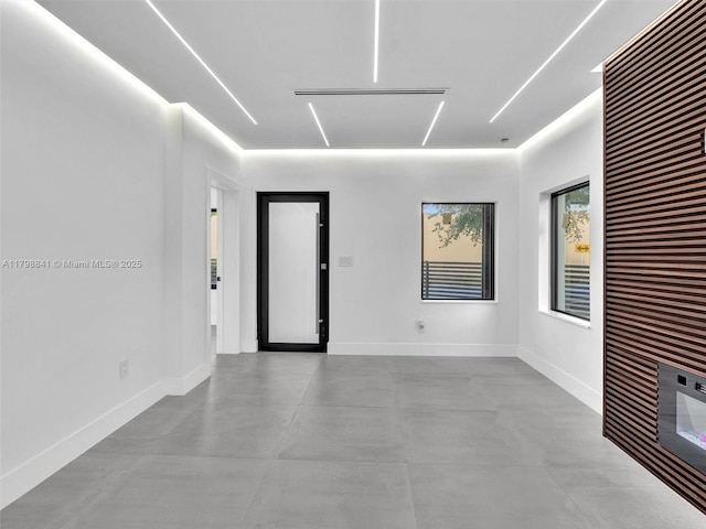 4921 NW 6th Ave, Miami, FL 33127 - spare room with a heating unit, finished concrete flooring, and baseboards