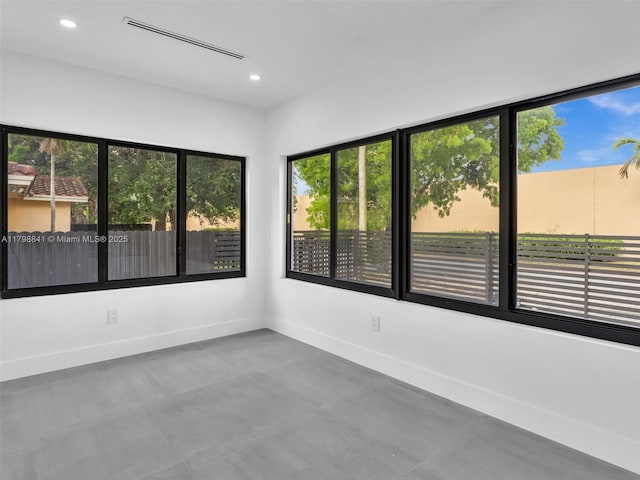 4921 NW 6th Ave, Miami, FL 33127 - spare room featuring baseboards, concrete flooring, and recessed lighting