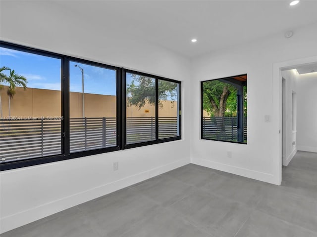 4921 NW 6th Ave, Miami, FL 33127 - empty room featuring recessed lighting, baseboards, finished concrete flooring, and a smoke detector