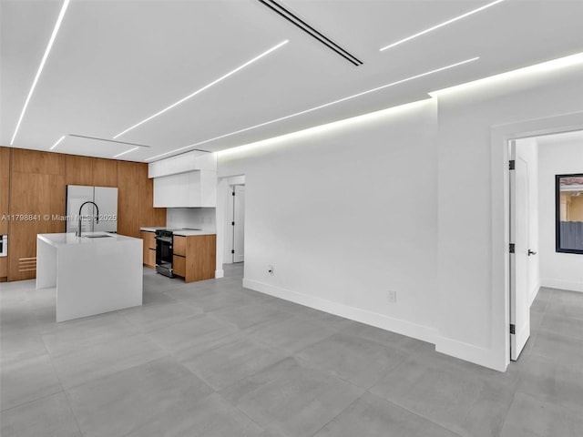 4921 NW 6th Ave, Miami, FL 33127 - unfurnished living room with a sink and baseboards