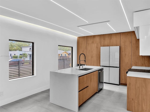 4921 NW 6th Ave, Miami, FL 33127 - kitchen with a sink, modern cabinets, freestanding refrigerator, dishwasher, and light countertops