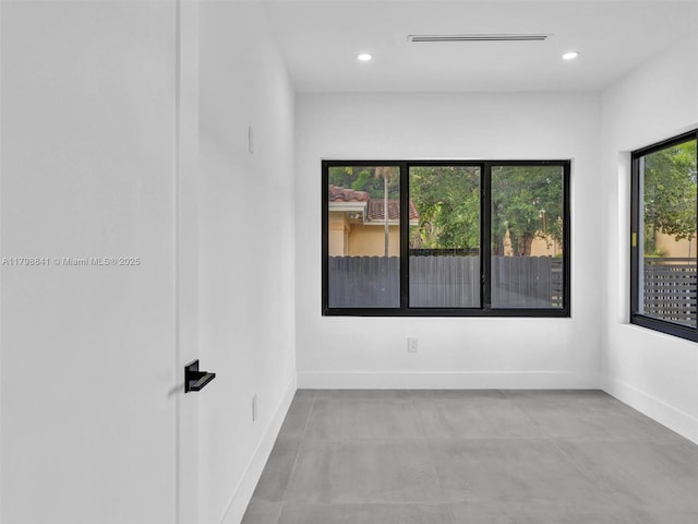 4921 NW 6th Ave, Miami, FL 33127 - empty room featuring baseboards, recessed lighting, and finished concrete flooring