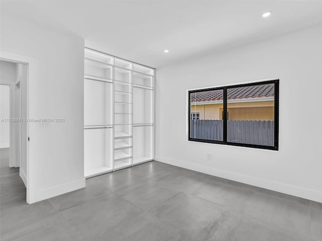 4921 NW 6th Ave, Miami, FL 33127 - unfurnished bedroom with baseboards, recessed lighting, and concrete floors