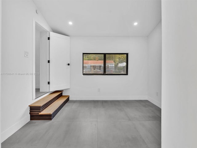 4921 NW 6th Ave, Miami, FL 33127 - empty room with finished concrete flooring, baseboards, and recessed lighting