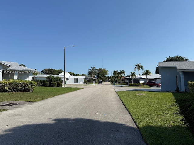 4909 Bayberry Ln, Tamarac, FL 33319 - view of asphalt street featuring street lighting