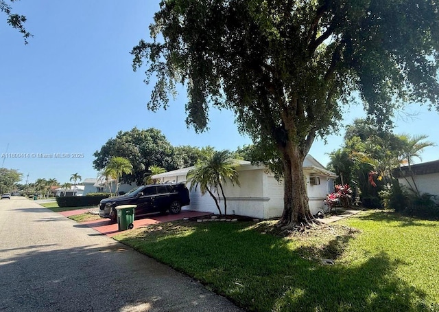 4909 Bayberry Ln, Tamarac, FL 33319 - view of property exterior with a lawn