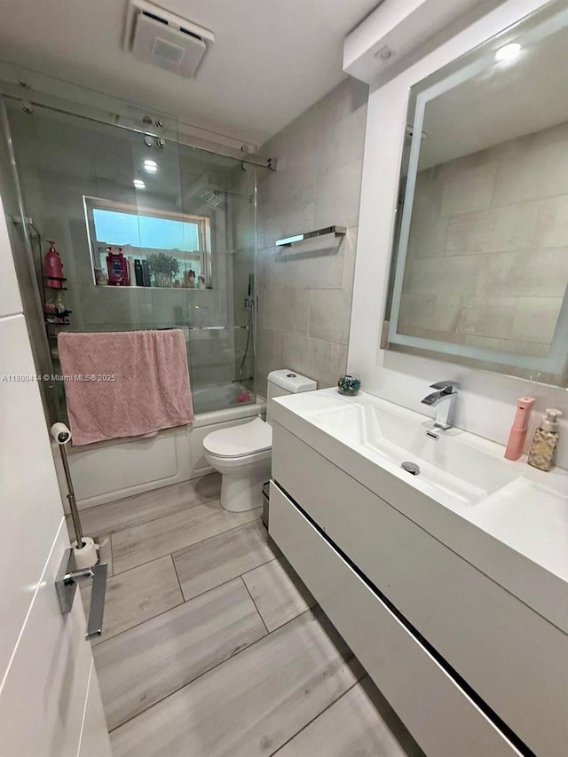 4909 Bayberry Ln, Tamarac, FL 33319 - bathroom featuring vanity and combined bath / shower with glass door