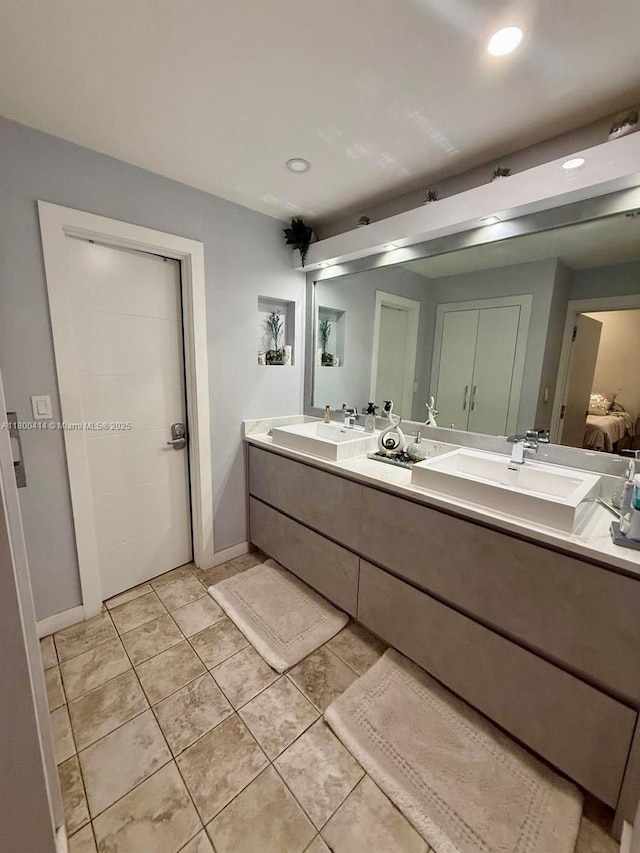 4909 Bayberry Ln, Tamarac, FL 33319 - full bath featuring double vanity, tile patterned flooring, and recessed lighting