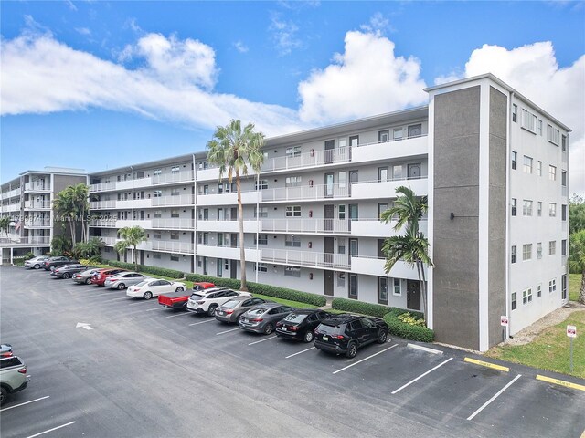 4800 Hillcrest Ln Unit 503, Hollywood, FL 33021 - view of apartment building / complex with uncovered parking