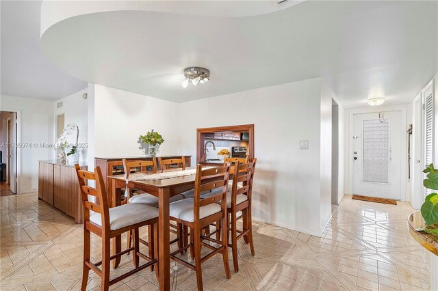 4800 Hillcrest Ln Unit 503, Hollywood, FL 33021 - dining space featuring light tile patterned floors and baseboards