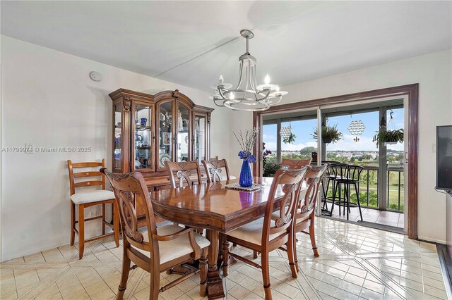4800 Hillcrest Ln Unit 503, Hollywood, FL 33021 - dining area featuring a chandelier and light tile patterned flooring