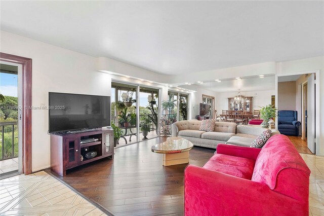 4800 Hillcrest Ln Unit 503, Hollywood, FL 33021 - living area with healthy amount of natural light and a chandelier