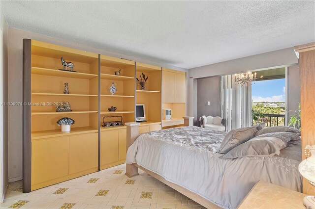 4800 Hillcrest Ln Unit 503, Hollywood, FL 33021 - bedroom with access to outside, a chandelier, and a textured ceiling
