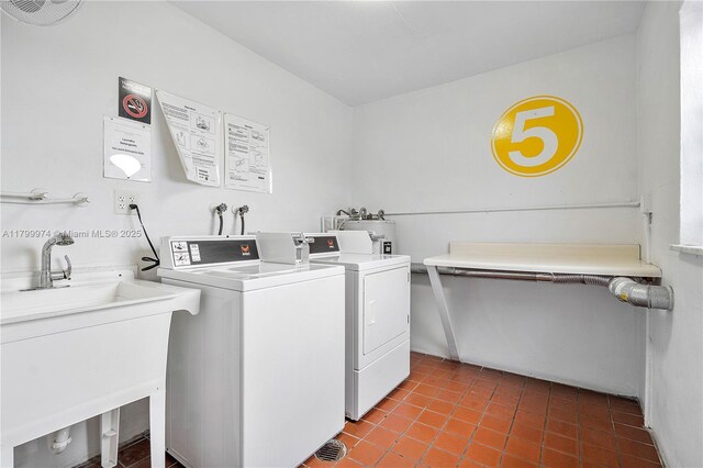 4800 Hillcrest Ln Unit 503, Hollywood, FL 33021 - shared laundry room with washing machine and clothes dryer and tile patterned flooring
