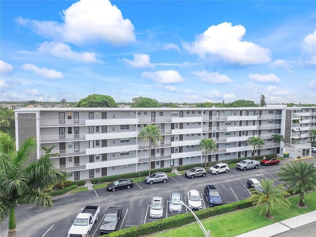 4800 Hillcrest Ln Unit 503, Hollywood, FL 33021 - view of apartment building / complex with uncovered parking