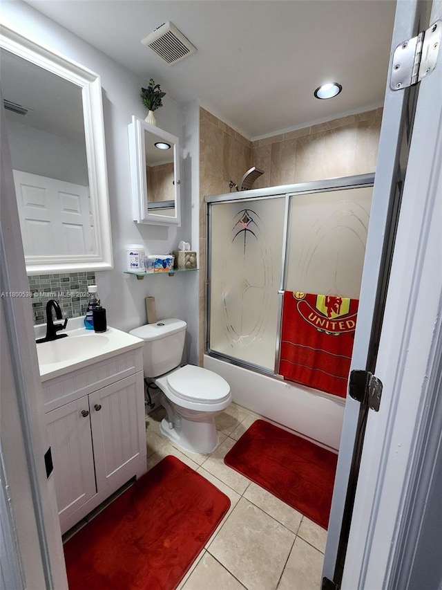 12430 SW 50th St Unit 147, Miramar, FL 33027 - full bathroom with enclosed tub / shower combo, tile patterned flooring, decorative backsplash, vanity, and toilet