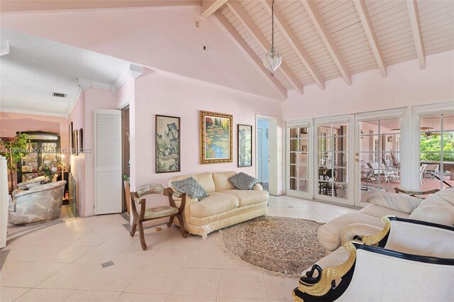 9905 SW 131st St, Miami, FL 33176 - living room with light tile patterned floors, beam ceiling, french doors, and high vaulted ceiling