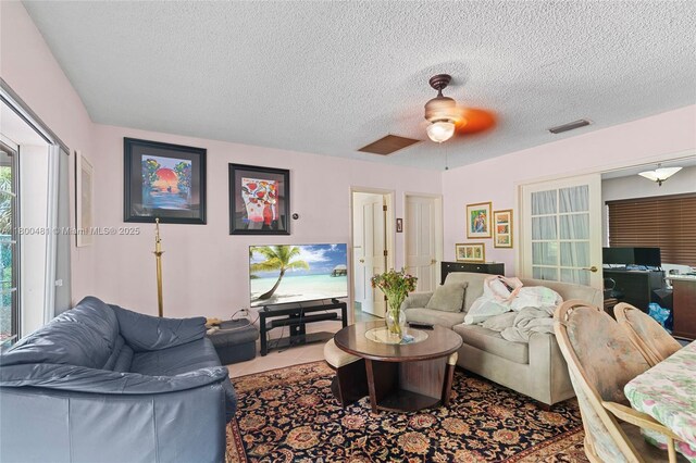 9905 SW 131st St, Miami, FL 33176 - living room with ceiling fan and a textured ceiling