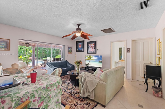9905 SW 131st St, Miami, FL 33176 - living room featuring ceiling fan, light tile patterned floors, and a textured ceiling