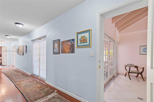 9905 SW 131st St, Miami, FL 33176 - corridor with a textured ceiling and baseboards