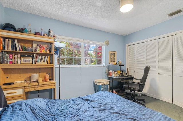 9905 SW 131st St, Miami, FL 33176 - carpeted bedroom featuring a closet, a textured ceiling, and an office area