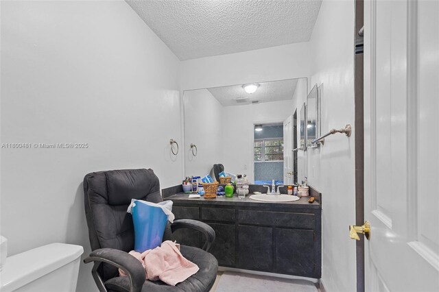 9905 SW 131st St, Miami, FL 33176 - bathroom with a textured ceiling, toilet, and vanity