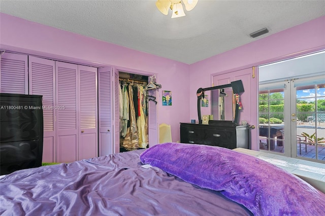 9905 SW 131st St, Miami, FL 33176 - bedroom with access to exterior, a textured ceiling, and french doors