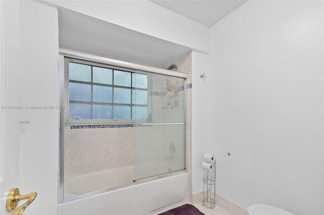 9905 SW 131st St, Miami, FL 33176 - bathroom featuring shower / bath combination with glass door and toilet