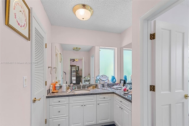9905 SW 131st St, Miami, FL 33176 - ensuite bathroom with vanity, a ceiling fan, and a textured ceiling