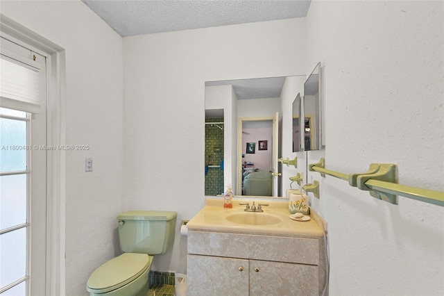 9905 SW 131st St, Miami, FL 33176 - bathroom with vanity, toilet, and a textured ceiling