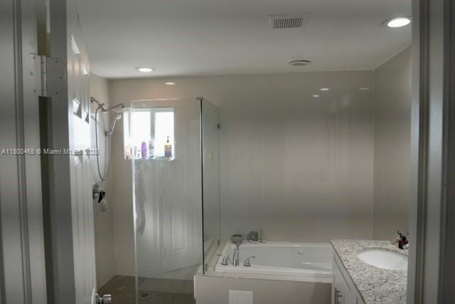 20600 SW 316th St, Homestead, FL 33030 - full bathroom with a shower stall, a bath, vanity, and recessed lighting