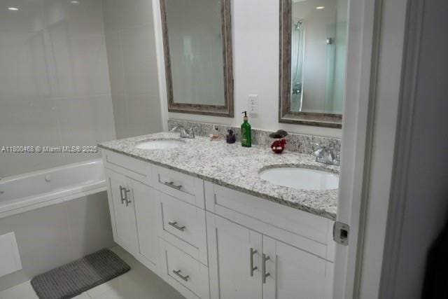 20600 SW 316th St, Homestead, FL 33030 - full bath featuring double vanity, a tub to relax in, and a shower