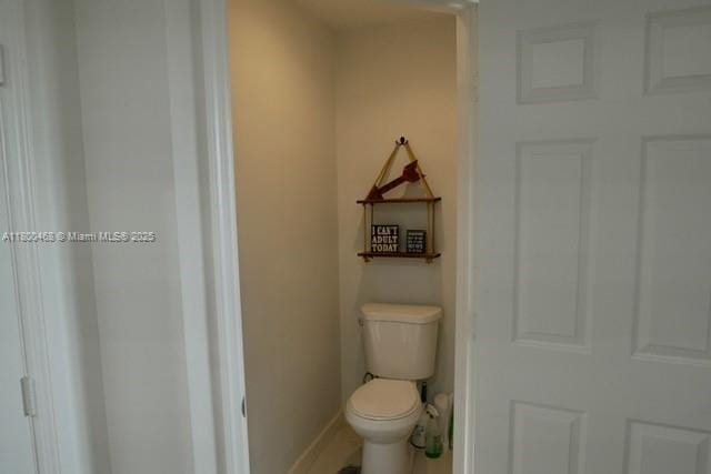 20600 SW 316th St, Homestead, FL 33030 - bathroom featuring toilet and baseboards