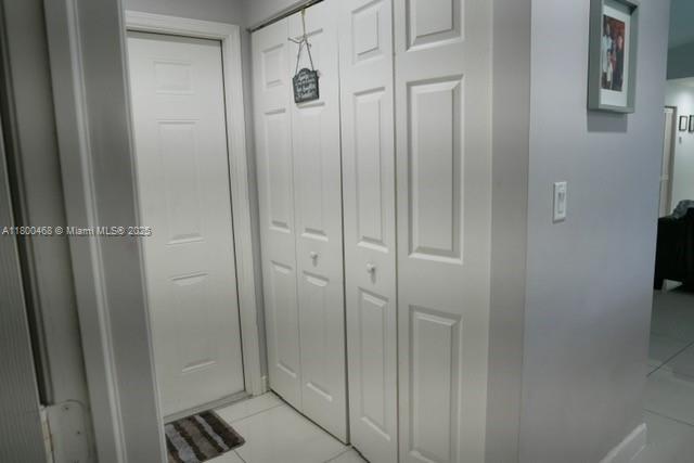 20600 SW 316th St, Homestead, FL 33030 - hallway with light tile patterned floors