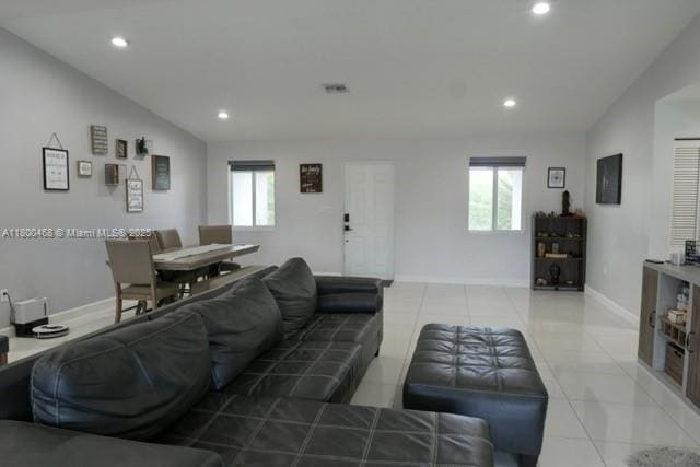 20600 SW 316th St, Homestead, FL 33030 - living room featuring healthy amount of natural light, light tile patterned floors, recessed lighting, baseboards, and lofted ceiling
