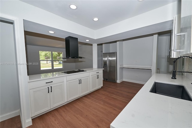 kitchen with stainless steel refrigerator with ice dispenser, extractor fan, a sink, black electric cooktop, and dark wood finished floors
