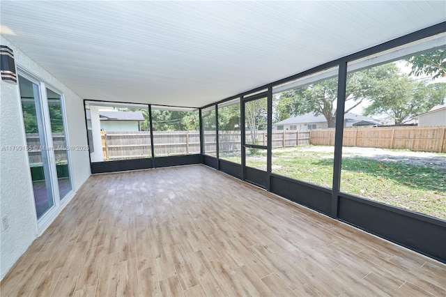unfurnished sunroom featuring healthy amount of natural light