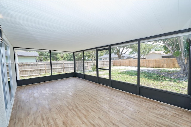 unfurnished sunroom with healthy amount of natural light