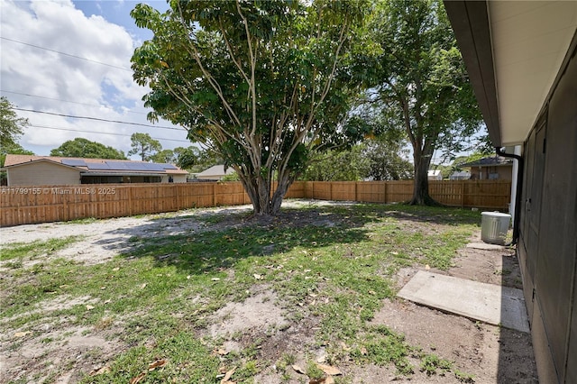fenced backyard with cooling unit