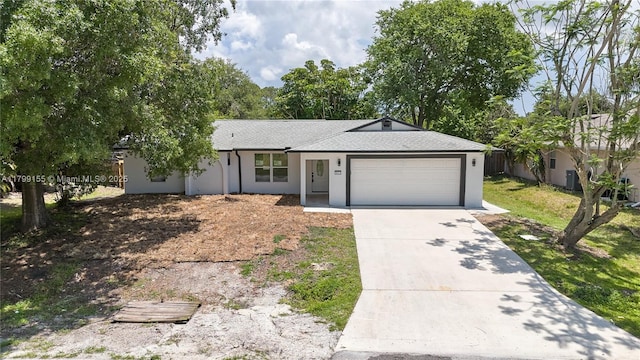 ranch-style home with an attached garage, concrete driveway, stucco siding, roof with shingles, and fence