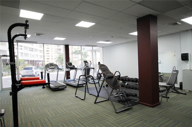 gym featuring carpet floors and a wall of windows